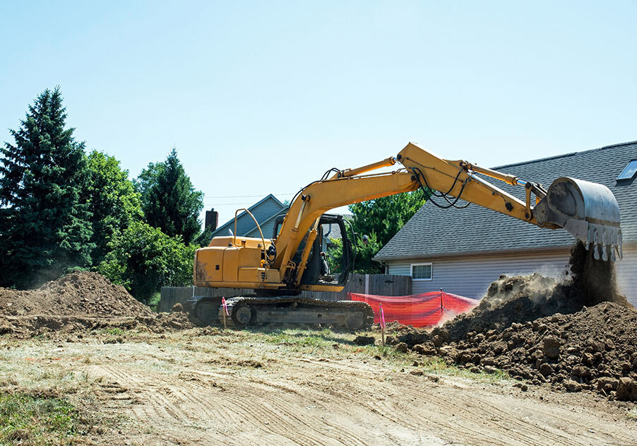 AdobeStock_514680202 Construction Backhoe Dumping Excavated Dirt